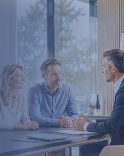 Best financial planners hero image showing financial adviser with clients.