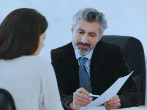Woman meeting with a financial planner to decide what happens when your financial adviser retires