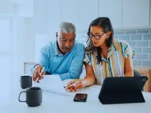 Couple reviewing their finances to determine how much super they need to retire in Australia