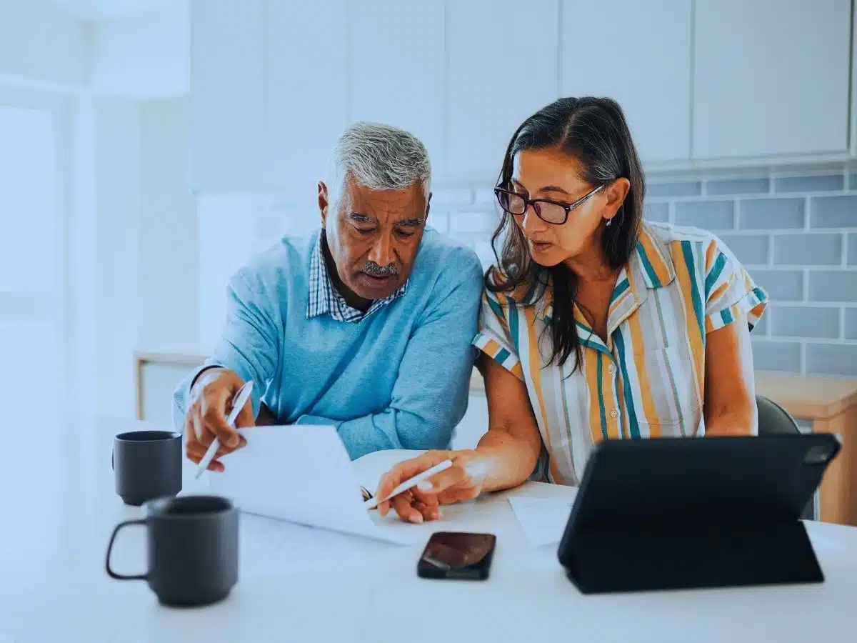 Couple reviewing their finances to determine how much super they need to retire in Australia