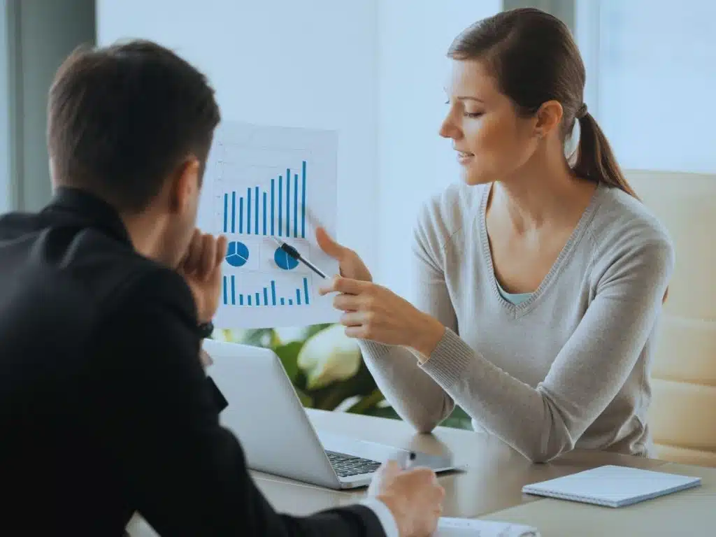 Is Financial Advice Worth It? Financial adviser discussing financial planning options with clients